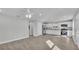 Open living room with wood-look flooring and ceiling fan at 110 5Th Sw St, Fort Meade, FL 33841