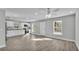 Open living room with wood-look flooring and ceiling fan at 110 5Th Sw St, Fort Meade, FL 33841