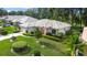 Single-Gathering home with a well-maintained lawn and landscaping at 202 Golf Aire Blvd, Winter Haven, FL 33884