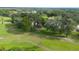Expansive backyard featuring mature trees providing ample shade and privacy at 202 Golf Aire Blvd, Winter Haven, FL 33884