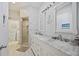 Bathroom with double vanity and marble countertop at 202 Golf Aire Blvd, Winter Haven, FL 33884