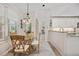 Charming breakfast nook with glass table and seating for four at 202 Golf Aire Blvd, Winter Haven, FL 33884