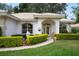 Beautiful home exterior featuring a well-manicured lawn and a welcoming front entrance at 202 Golf Aire Blvd, Winter Haven, FL 33884