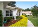Well-maintained landscaping and a walkway to the entrance at 202 Golf Aire Blvd, Winter Haven, FL 33884