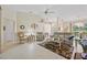 Inviting living room with vaulted ceilings, neutral decor, and abundant natural light at 202 Golf Aire Blvd, Winter Haven, FL 33884