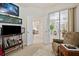 Home office with built-in shelving and access to sunroom at 202 Golf Aire Blvd, Winter Haven, FL 33884