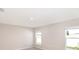 Bright and airy bedroom with neutral colors, carpet and two windows at 2433 Leeds St, Haines City, FL 33844