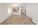 Bright, spacious living room with hardwood floors, neutral paint, and ample natural light at 2433 Leeds St, Haines City, FL 33844