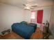 Cozy bedroom with two twin beds, wood floors, and bright window coverings at 3597 Raintree Ln, Lakeland, FL 33803