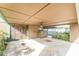 View of a carport with a storage shed and a screened doorway at 3597 Raintree Ln, Lakeland, FL 33803