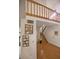 Entryway with hardwood floors, staircase, and a railing overlooking the space at 3597 Raintree Ln, Lakeland, FL 33803
