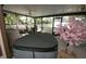 A covered hot tub on a screened in patio area at 3597 Raintree Ln, Lakeland, FL 33803