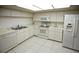 Bright kitchen features white appliances and ample counter space, great for cooking at 3597 Raintree Ln, Lakeland, FL 33803