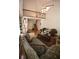 Bright living room with vaulted ceilings, hardwood floors, and a decorative railing overlooking the space at 3597 Raintree Ln, Lakeland, FL 33803