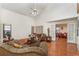 Spacious living room with hardwood floors, high ceilings, and large windows at 3597 Raintree Ln, Lakeland, FL 33803