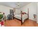 Spacious main bedroom with wood flooring, ceiling fan, and lots of natural light at 3597 Raintree Ln, Lakeland, FL 33803