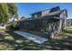 Relaxing screened patio with an outdoor seating area and a ceiling fan at 3597 Raintree Ln, Lakeland, FL 33803