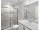 Modern bathroom with tiled shower, glass door, vanity and sink at 428 Ituna Cir, Winter Haven, FL 33881