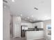 Bright, open-concept kitchen with stainless steel appliances, granite counters, and ample cabinet space at 428 Ituna Cir, Winter Haven, FL 33881