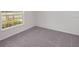Bright bedroom showcasing plush carpet and natural light at 468 Ituna Cir, Winter Haven, FL 33881