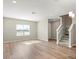 Bright and spacious living room with hardwood floors and lots of natural light at 5742 Anders Way, St Cloud, FL 34771