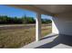 Covered back patio with a view of the landscaped backyard at 596 Ituna Cir, Winter Haven, FL 33881