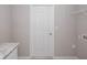 Convenient laundry room with counter space, storage, and washer/dryer hookups at 596 Ituna Cir, Winter Haven, FL 33881