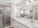 Spa-like bathroom featuring double vanities, a walk-in shower, and modern fixtures at 720 Bayside Blvd, Winter Haven, FL 33881