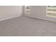 Inviting bedroom featuring soft carpeting and dual windows providing ample light at 720 Bayside Blvd, Winter Haven, FL 33881