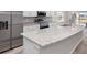 Modern kitchen featuring an island, stainless steel appliances, and granite countertops at 720 Bayside Blvd, Winter Haven, FL 33881
