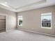Bright, spacious bedroom featuring neutral walls, carpeted floors, and two windows for natural light at 723 Bentley North Loop, Auburndale, FL 33823