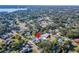 An aerial view of a home with a pool, surrounded by lush landscaping and mature trees at 1323 Valley E Hl, Lakeland, FL 33813
