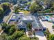 Aerial view of the home showing its large, unique footprint, fenced yard and in-ground pool at 1323 Valley E Hl, Lakeland, FL 33813