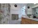 Bathroom featuring double sinks, toilet, shower-tub, and nature-themed decor, complemented by towels and necessities at 1323 Valley E Hl, Lakeland, FL 33813