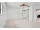 This simple bedroom features carpet, a window, and a mirrored closet at 1323 Valley E Hl, Lakeland, FL 33813