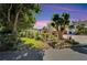 Charming home with lush landscaping, mature trees, and well-maintained lawn, creating a welcoming curb appeal at 1323 Valley E Hl, Lakeland, FL 33813