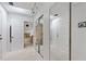 Well-lit hallway leads to a bathroom and a bedroom with mirrored closet doors at 1323 Valley E Hl, Lakeland, FL 33813