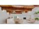 Stylish living room features beamed ceilings, brick fireplace, and elegant furnishings at 1323 Valley E Hl, Lakeland, FL 33813