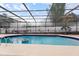 Enjoy this beautiful pool with a screened-in enclosure and landscaped surroundings at 1323 Valley E Hl, Lakeland, FL 33813