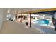 Aerial view of a large, sunny pool area with spa and decorative elements at 1323 Valley E Hl, Lakeland, FL 33813