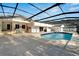 Lovely pool area with a blue liner and stone deck, with an outdoor patio nearby at 1323 Valley E Hl, Lakeland, FL 33813
