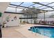 The pool area features an in-ground spa and unique wall decor at 1323 Valley E Hl, Lakeland, FL 33813