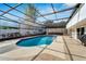 Spacious screened pool area with crystal-clear water and ample deck space, offering a refreshing escape at 1323 Valley E Hl, Lakeland, FL 33813