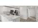 Stylish kitchen showcasing marble countertops, stainless steel appliances, and a sleek design at 305 Wharf Way, Winter Haven, FL 33881
