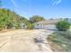 Spacious driveway leading to the garage, providing ample parking at 309 W Frederick Ave, Dundee, FL 33838