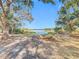 View of the lake through the trees, highlighting the property's scenic location at 309 W Frederick Ave, Dundee, FL 33838