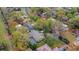 Aerial image of a single-Gathering home with mature trees, manicured landscaping, and a well-maintained backyard at 3845 Garnet Dr, Mulberry, FL 33860