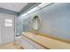 Well-lit bathroom with extended vanity, neutral color scheme, and tiled floor at 3845 Garnet Dr, Mulberry, FL 33860