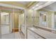 Bathroom features a vanity, large mirror, and lots of cabinet space at 3845 Garnet Dr, Mulberry, FL 33860