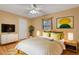 Bedroom with television, decorative elements and wood floor at 3845 Garnet Dr, Mulberry, FL 33860